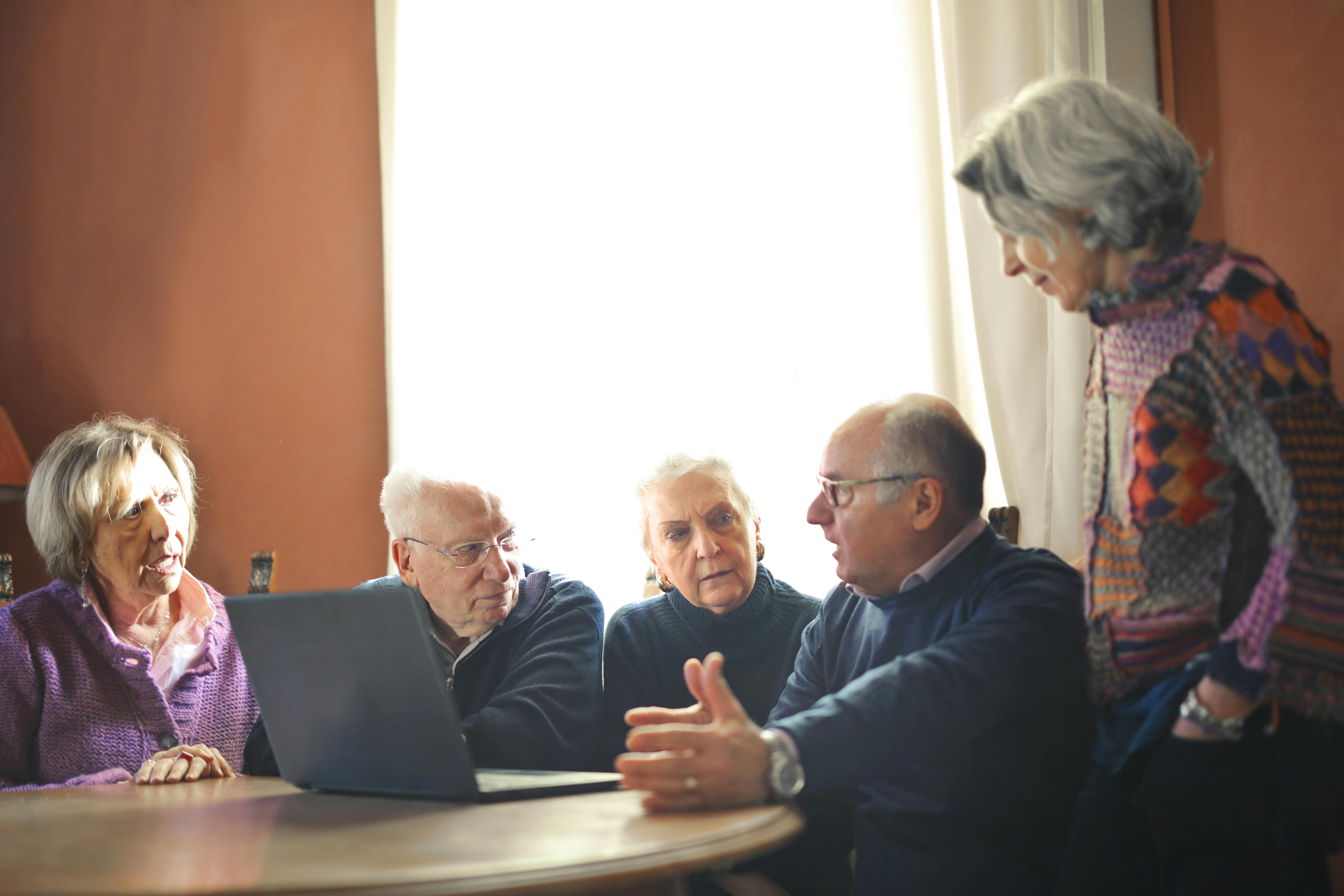 Group of diverse seniors smiling together at a UNSVCC event
