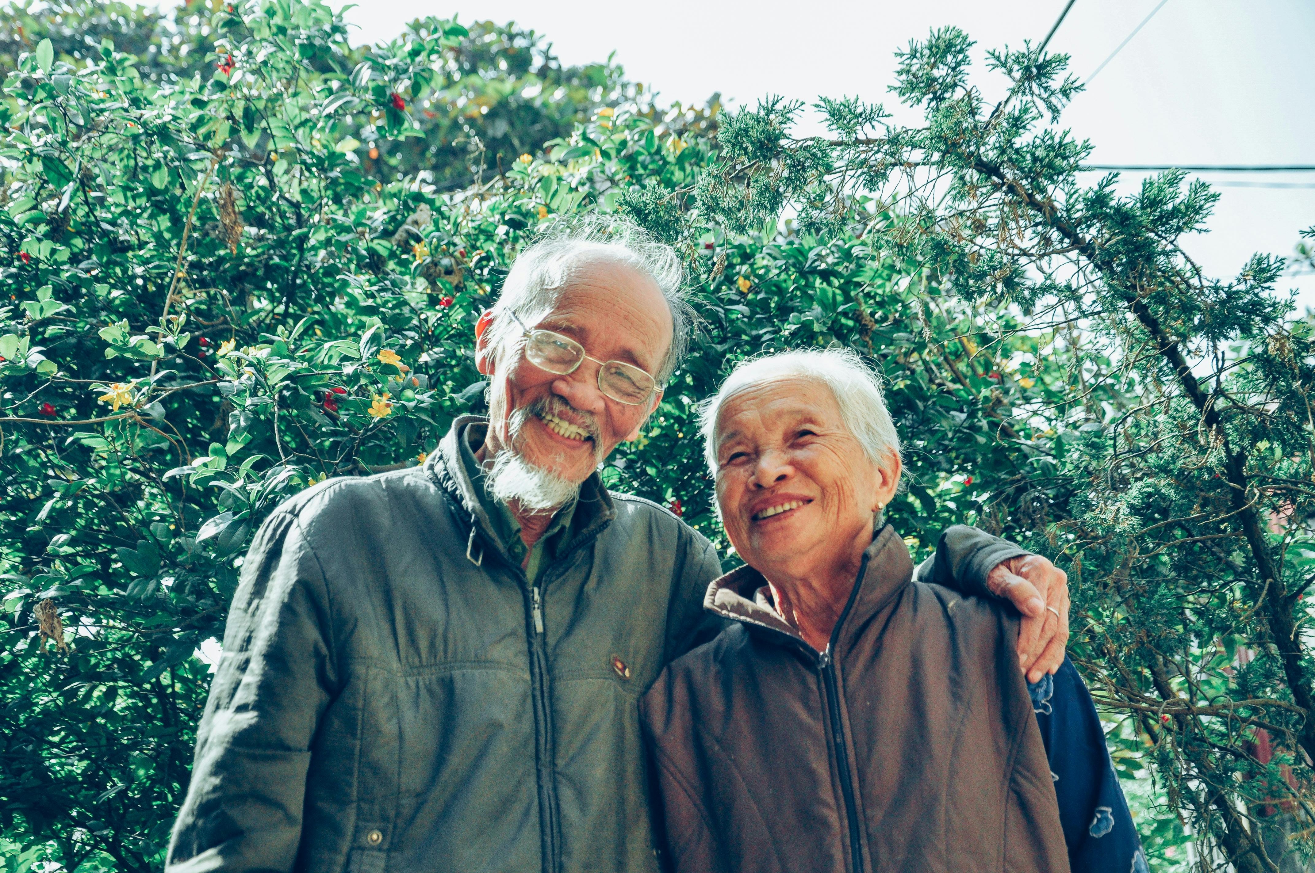 Happy senior couple smiling together outdoors